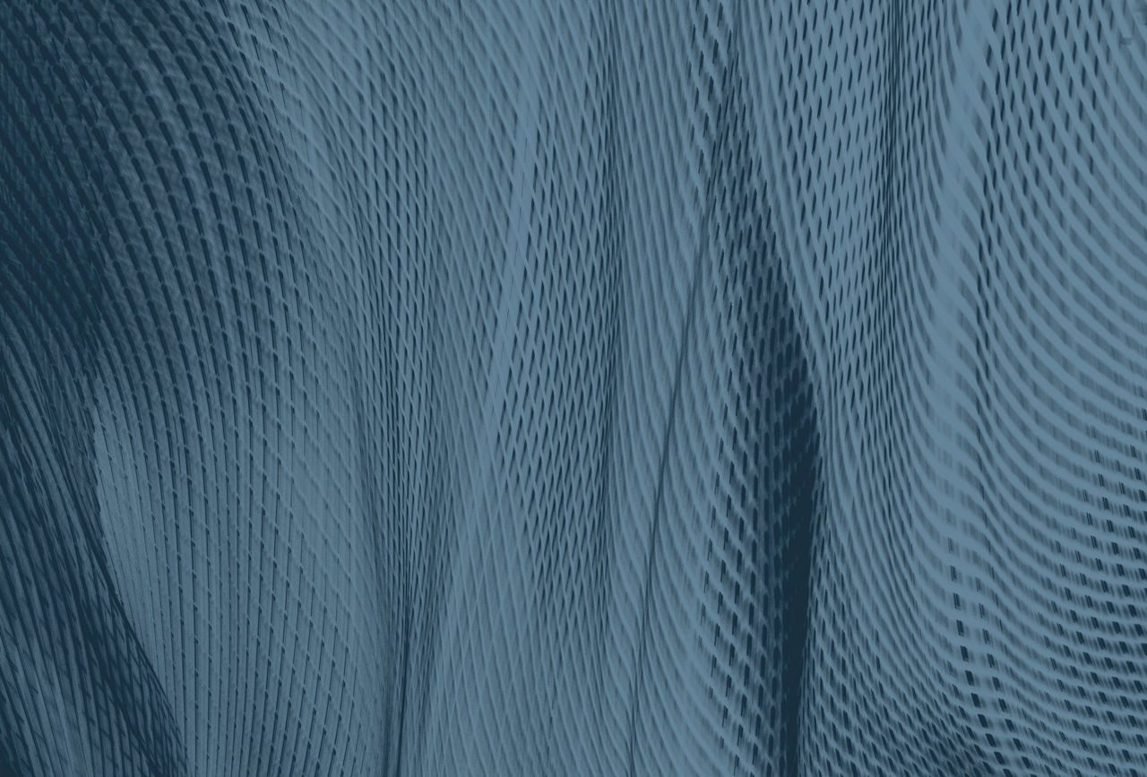 Blurred motion of blue lights creating abstract fabric effect - slate texture